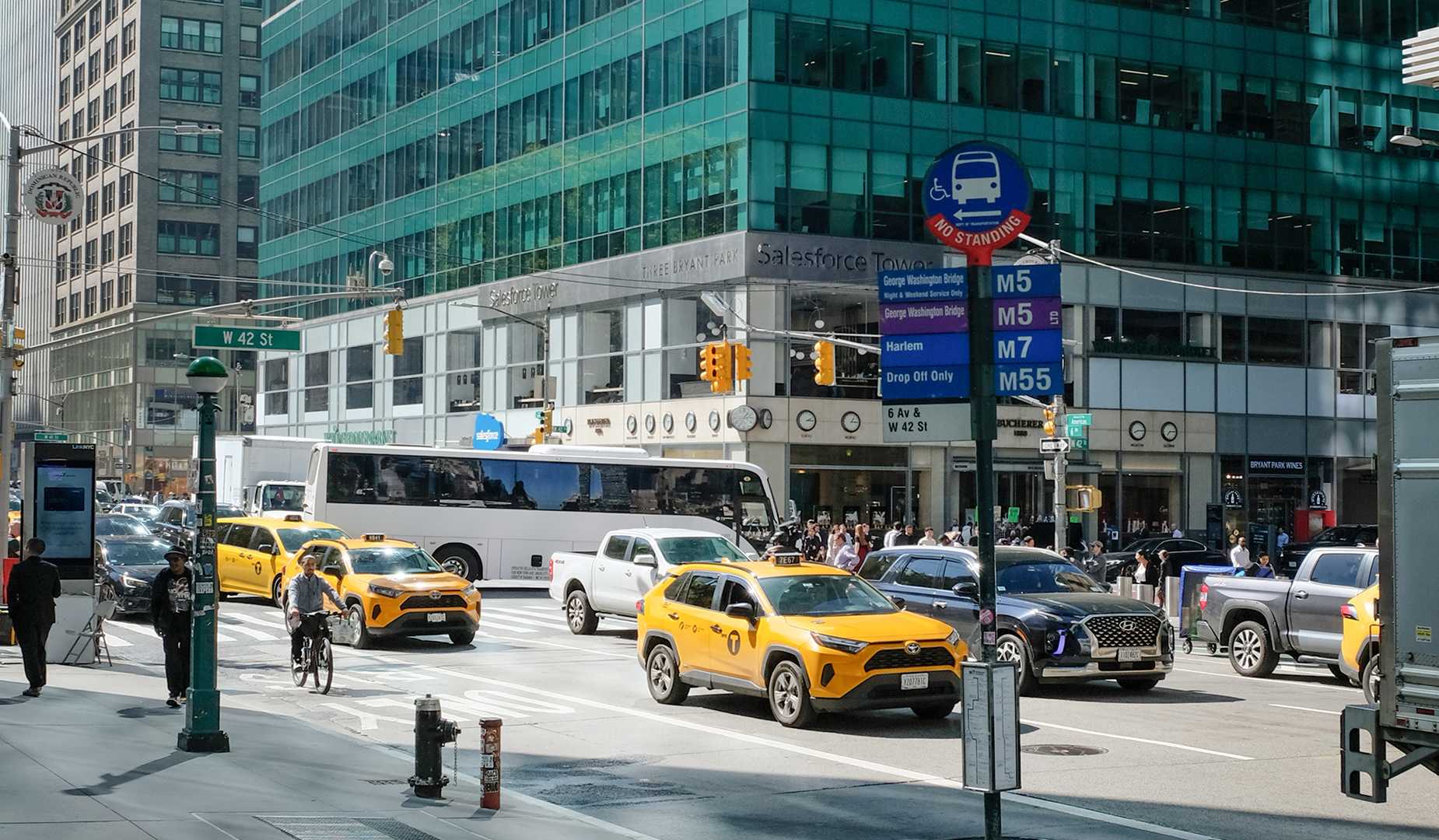 A picture of northbound traffic on Avenue of the Americas on a bright, sunny day.